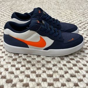 Men’s navy blue and orange Nikes
